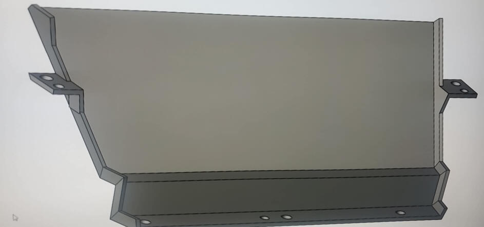 CAD rendering showing side view of a custom center console delete plate with mounting tabs and recessed lower section.